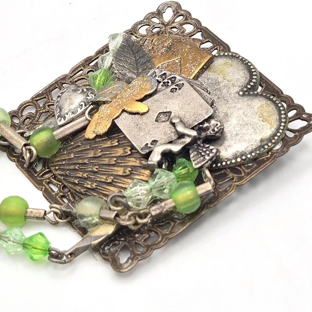 Mixed Metal Assemblage Brooch Cherub Heart Playing Cards Green Glass Bead Dangle